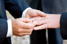 Men exchanging rings at wedding © Lisa F. Young/Shutterstock.com