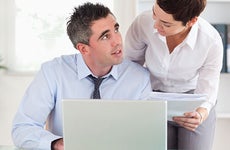 Couple man at a computer reviewing documents © wavebreakmedia/Shutterstock.com