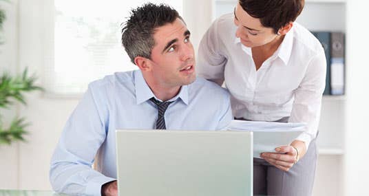 Couple man at a computer reviewing documents © wavebreakmedia/Shutterstock.com