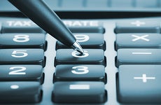 Pen pushing calculator numbers © doomu/Shutterstock.com