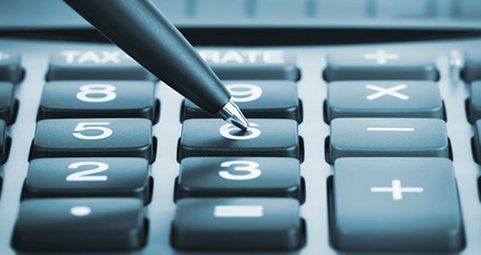 Pen pushing calculator numbers © doomu/Shutterstock.com