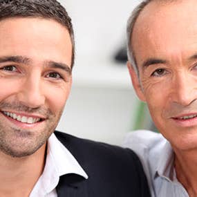 Senior father younger son embracing © auremar-Shutterstock.com