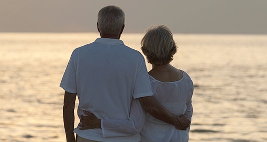 Senior couple watching sunset over horizon © Darren Baker/Shutterstock.com