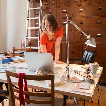Woman working in home office | Simon Ritzmann/Getty Images