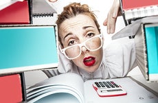 Secretary or accountant stressed at paperwork © ndphoto/Shutterstock.com