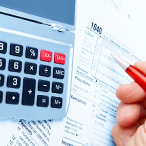 Working on taxes © iStockPhoto.com