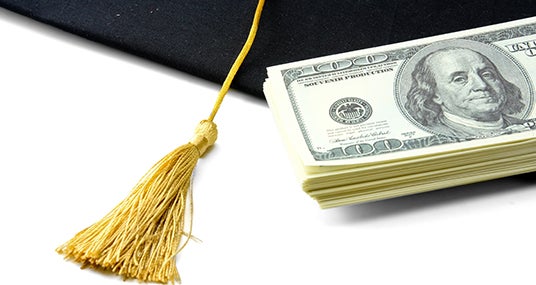 Graduation cap and money © lenetstan/Shuttersstock.com