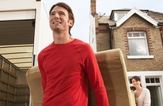 Young couple moving sofa to their new home  © bikeriderlondon/Shutterstock.com