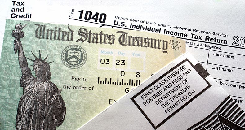 United States Treasury tax refund check and tax form © iStock