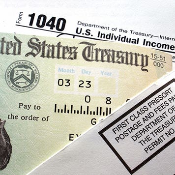 United States Treasury tax refund check and tax form © iStock
