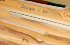 Folder of tax receipts | iStock.com/Lanica Klein