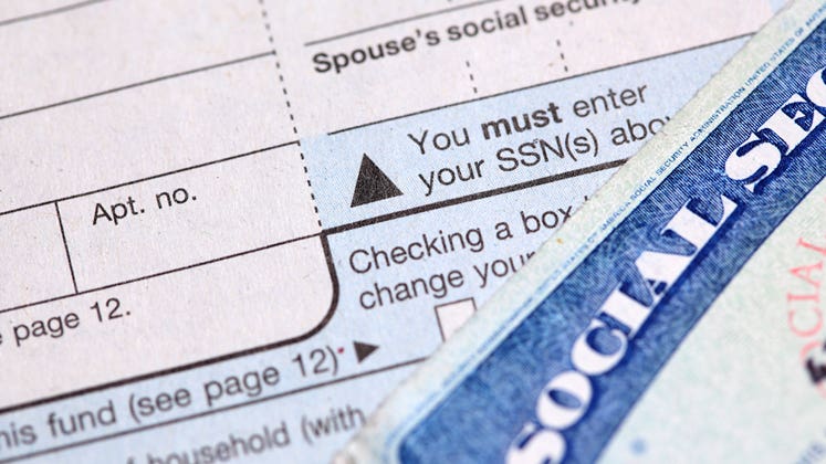 Social security card and tax form © iStock