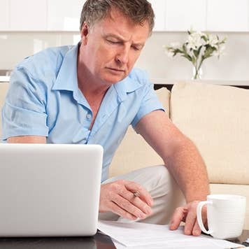 Older man, budgeting © iStock