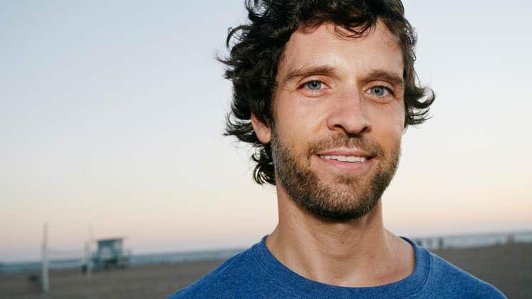 Man smiling, standing outside | Peathegee Inc/Blend Images/Getty Images