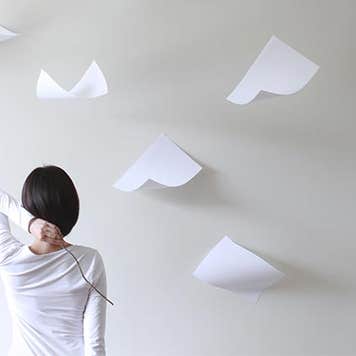 Papers falling from height | Pchyburr/Getty Images