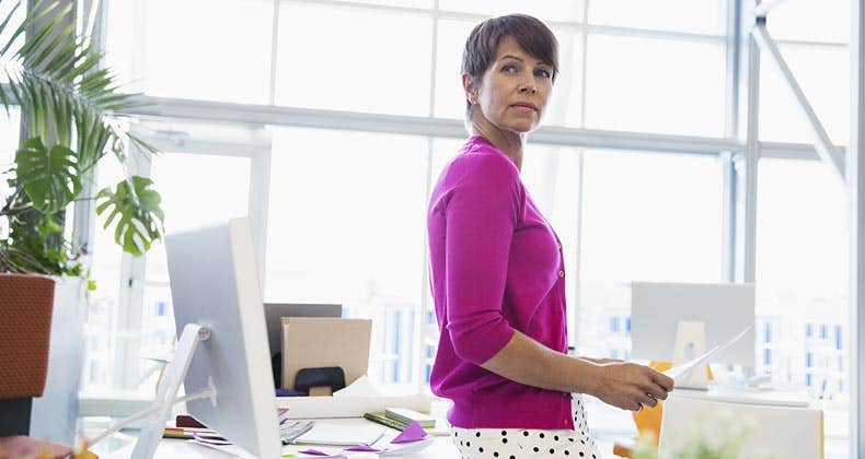 Woman working in bright, open office space | Hero Images/Getty Images
