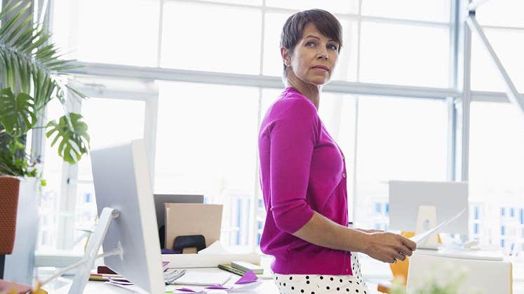 Woman working in bright, open office space | Hero Images/Getty Images