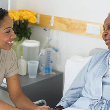 Woman visiting her mother in the hospital | JGI/Tom Grill/Getty Images