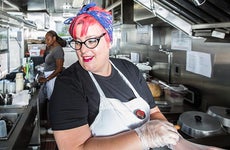 Cook working in restaurant kitchen | CREATISTA/Shutterstock.com