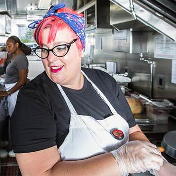 Cook working in restaurant kitchen | CREATISTA/Shutterstock.com