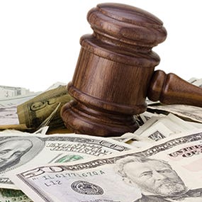 Gavel on pile of money © VIPDesign - Fotolia.com