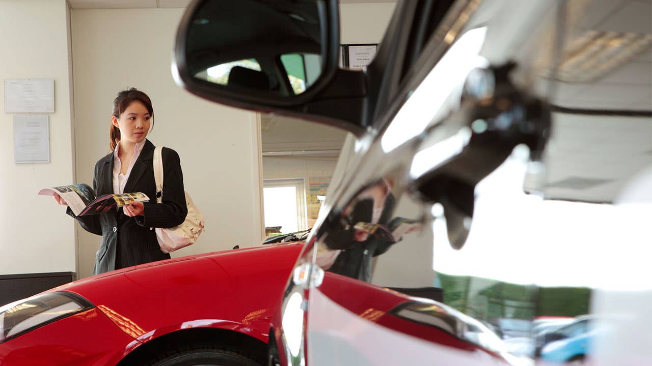 woman at car dealership