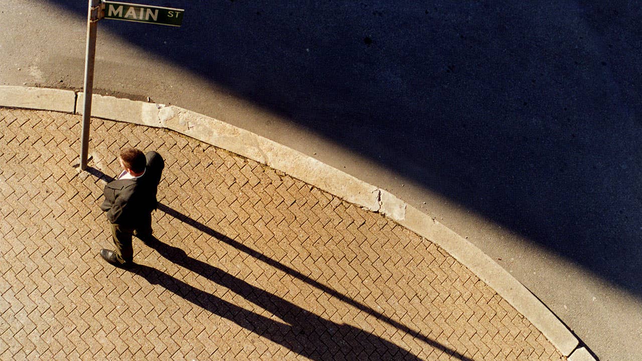 Man with a long shadow