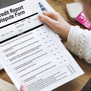 Woman reviewing credit report dispute form