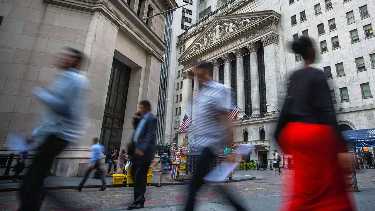 People walking by New York Stock Exchange