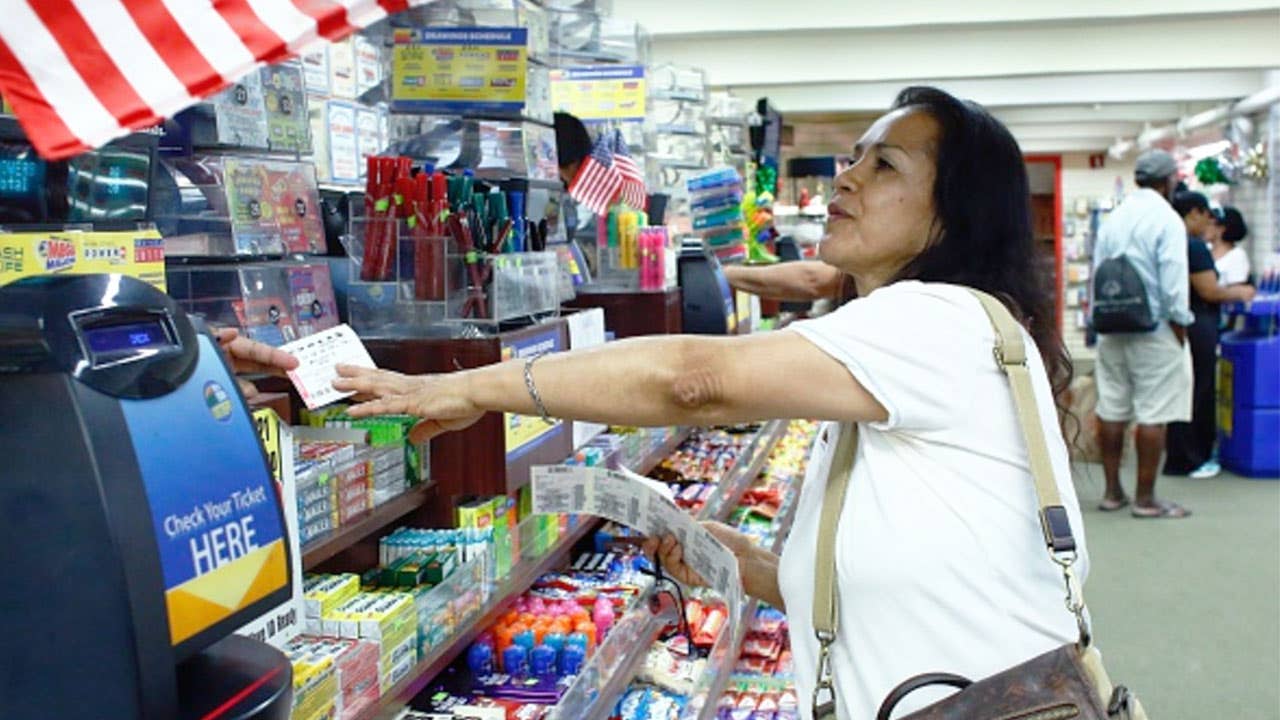 Woman buying powerball tickets