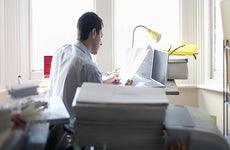 Man sitting in home office © bikeriderlondon/Shutterstock.com