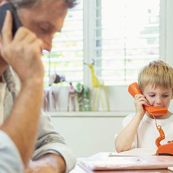 Toddler playing with toy phone | Paul Bradbury/Getty Images