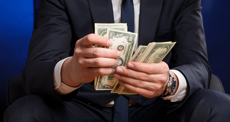 Man counting money © Sergey Mironov/Shutterstock.com