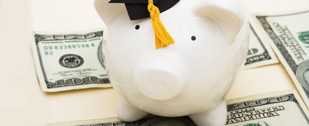 Piggy bank wearing graduation cap © karen roach/Shutterstock.com
