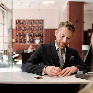 Man standing at bank counter