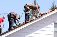 Men repairing roof