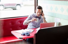 Man in a diner talking on the phone