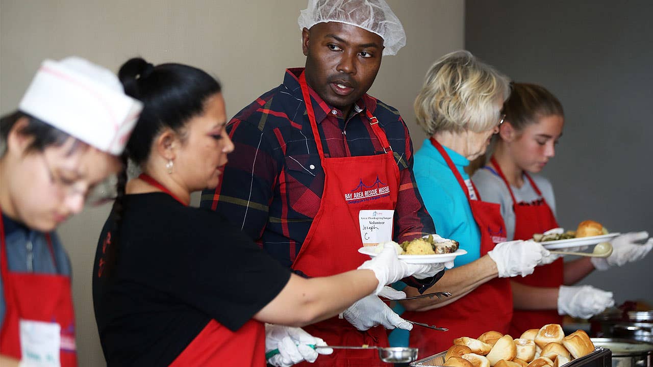 Americans volunteering in a soup kitchen on Thanksgiving