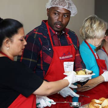 Americans volunteering in a soup kitchen on Thanksgiving