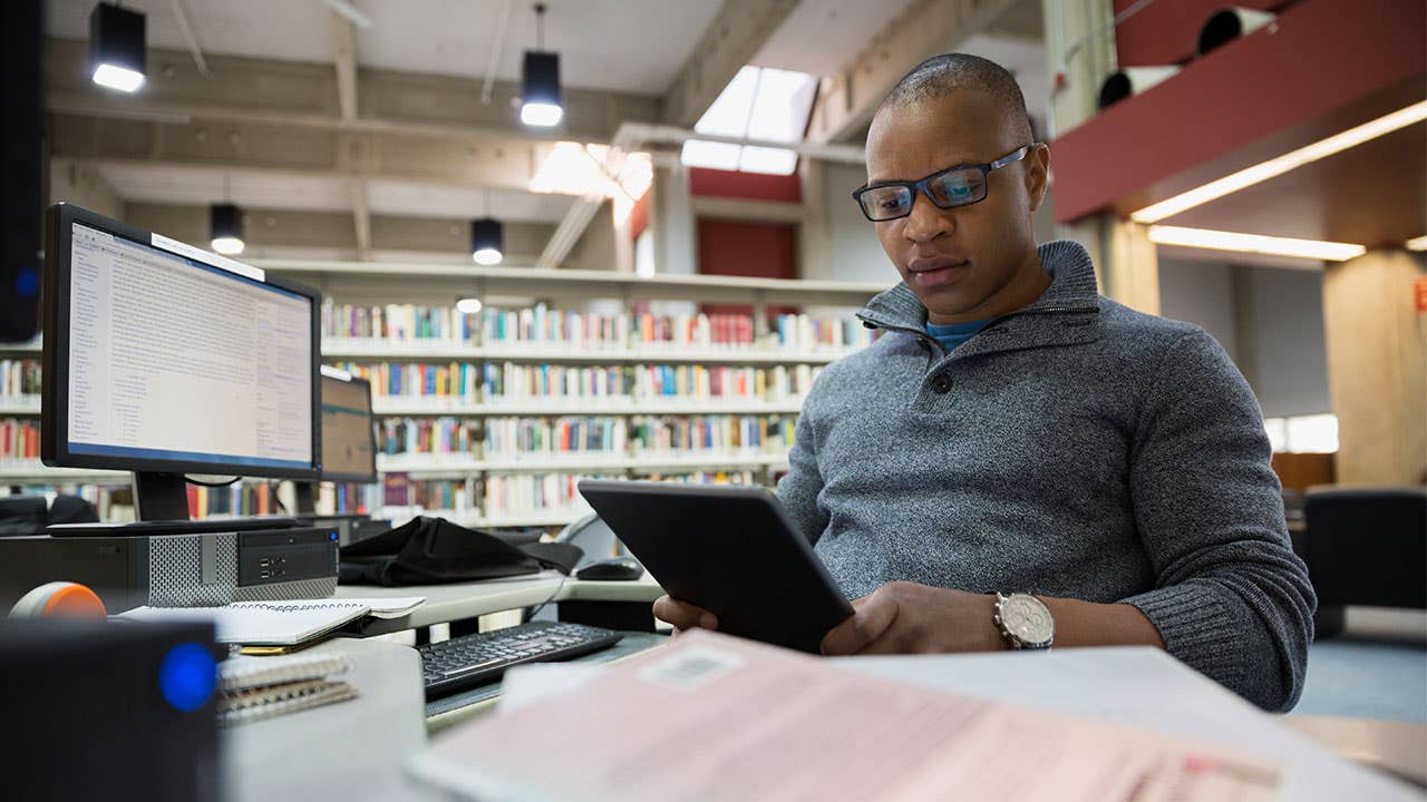 Man in library studying