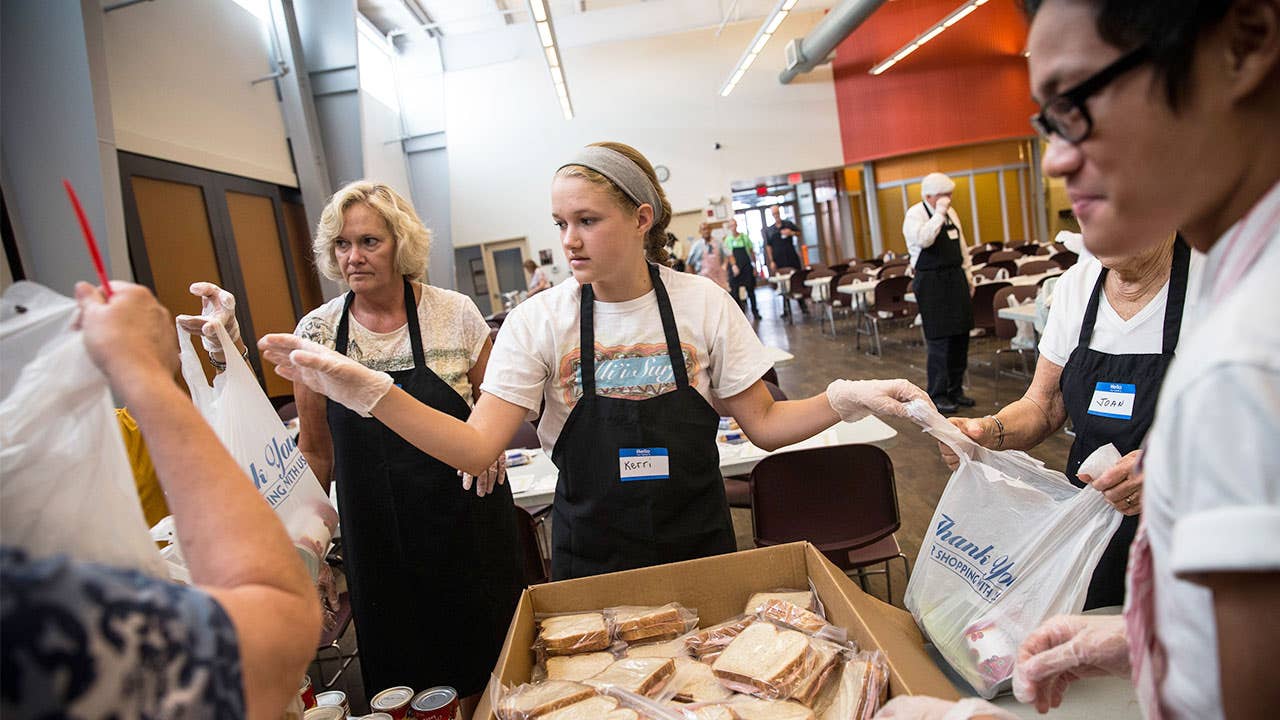 Volunteers packing lunches for charity