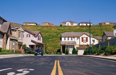 Suburban neighborhood with homes on a street and hill