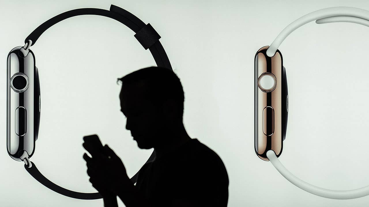 Man with phone in Apple Watch