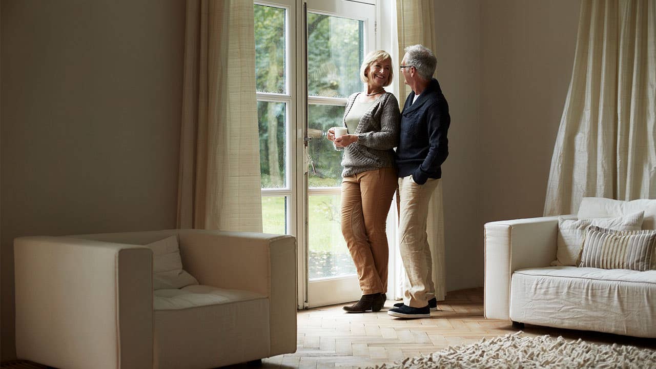 Older couple looking out of the window