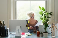 Woman working from home filling out forms