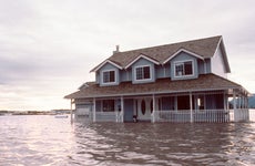 Two-story home inundated by floodwater.