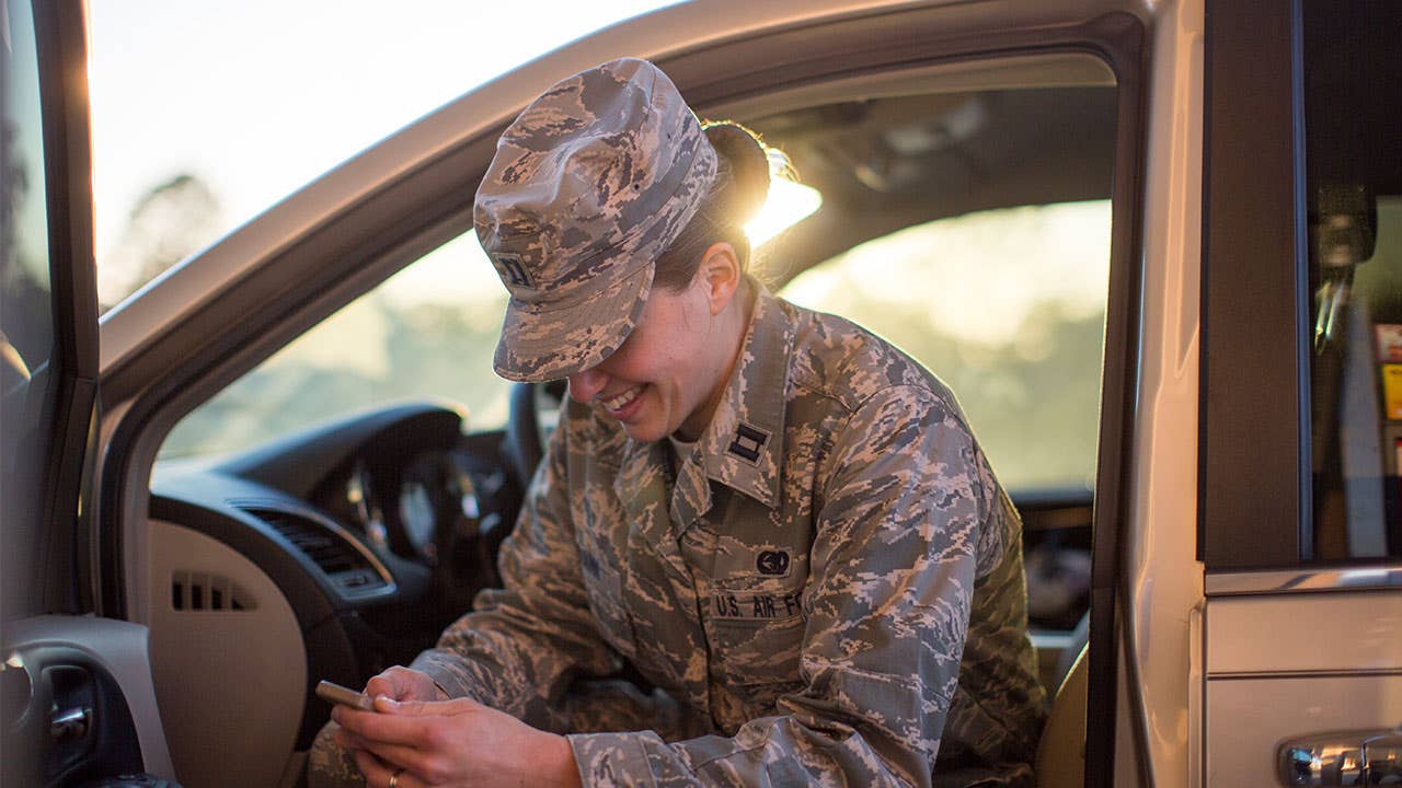 Woman solider checking phone