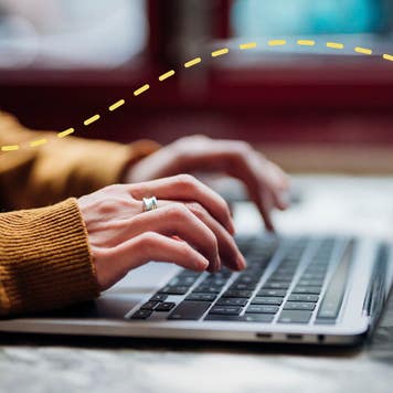 woman typing on a laptop