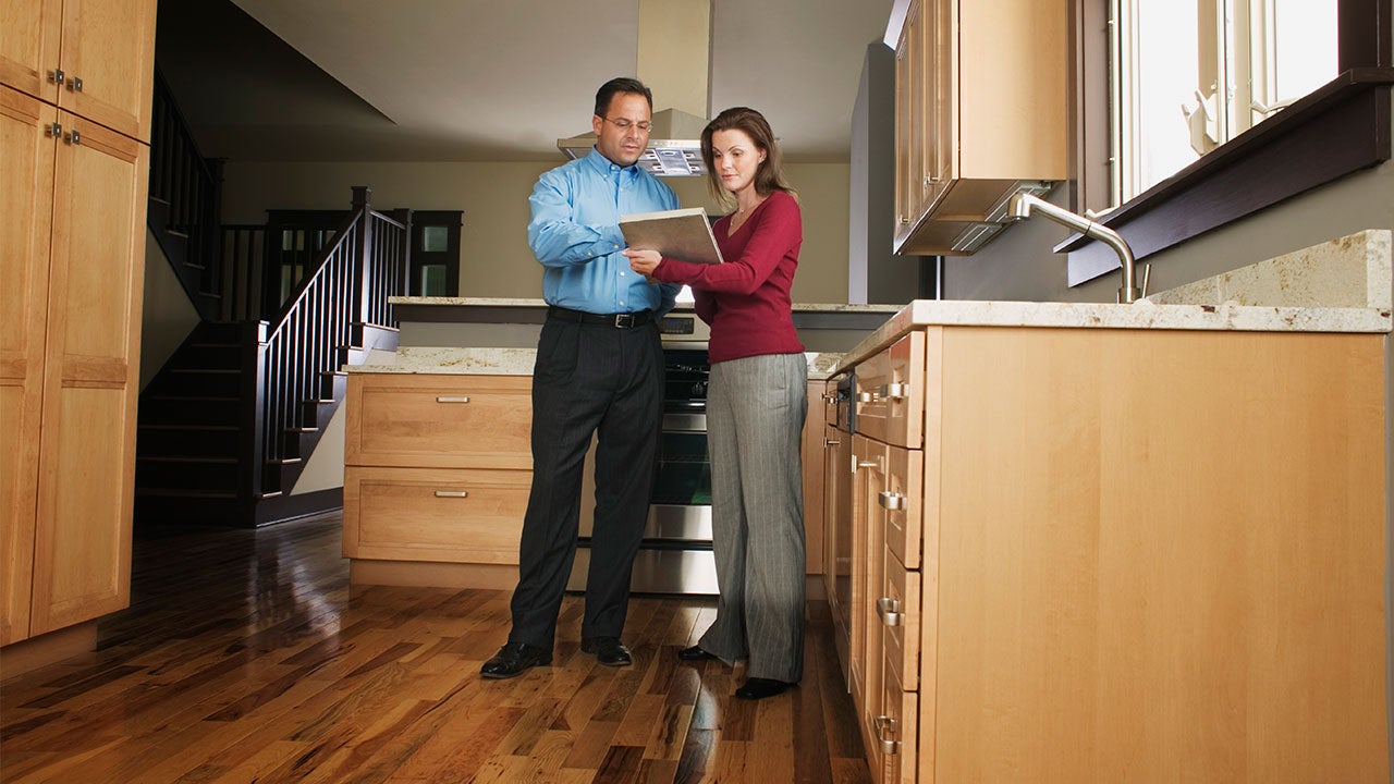 Relator with prospective home buyer