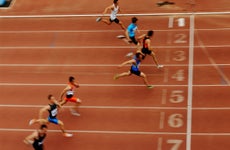 Men crossing finish line